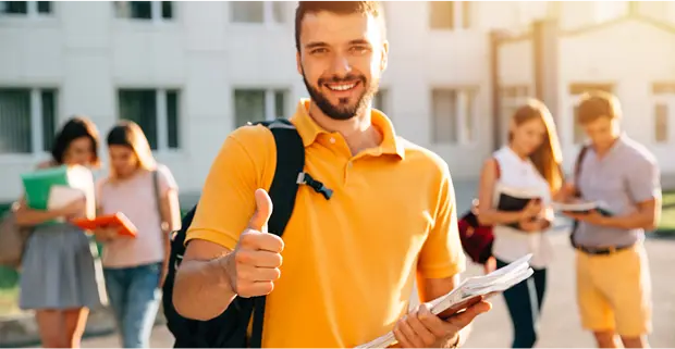 Man with a thumb up wearing a backpack and holding papers