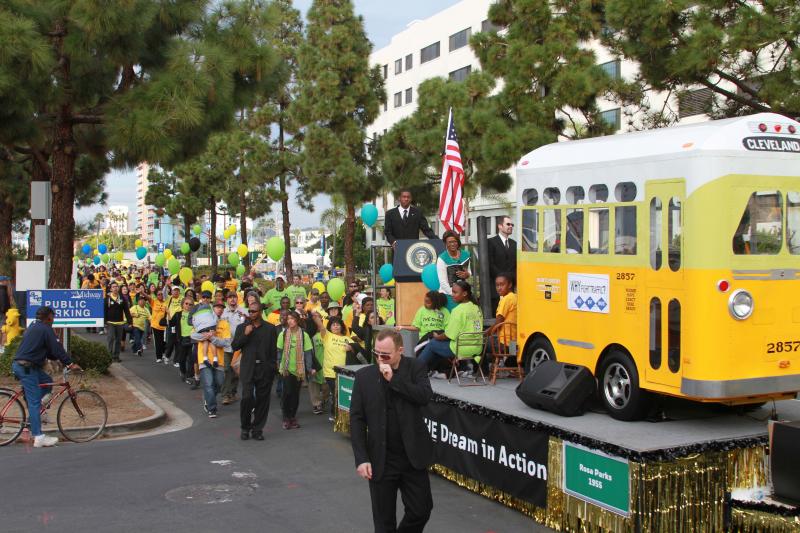 Parade float and students marching